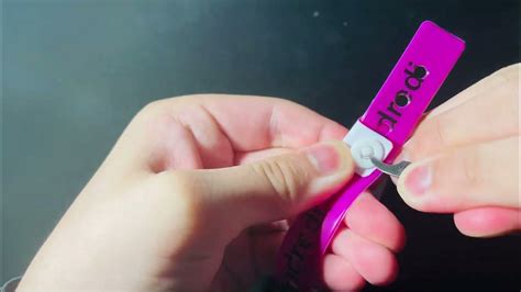 How to Remove & Reuse a Convention Wristband with a Button .